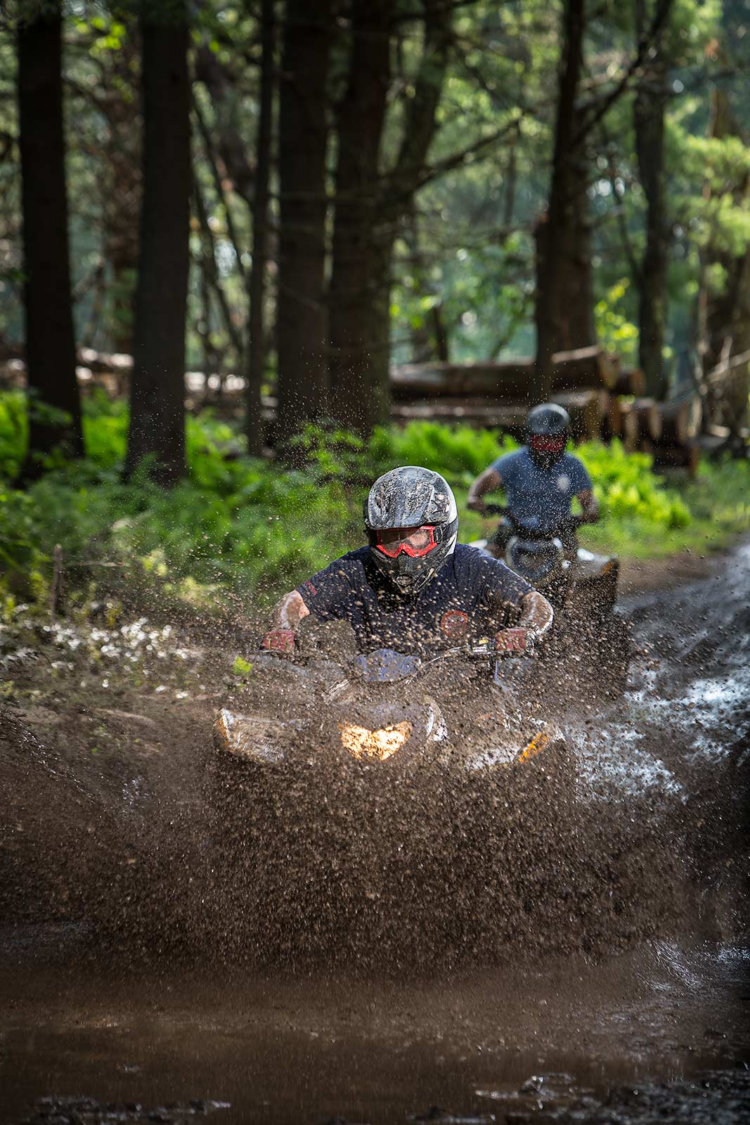 Teenage boyscouts riding ATV