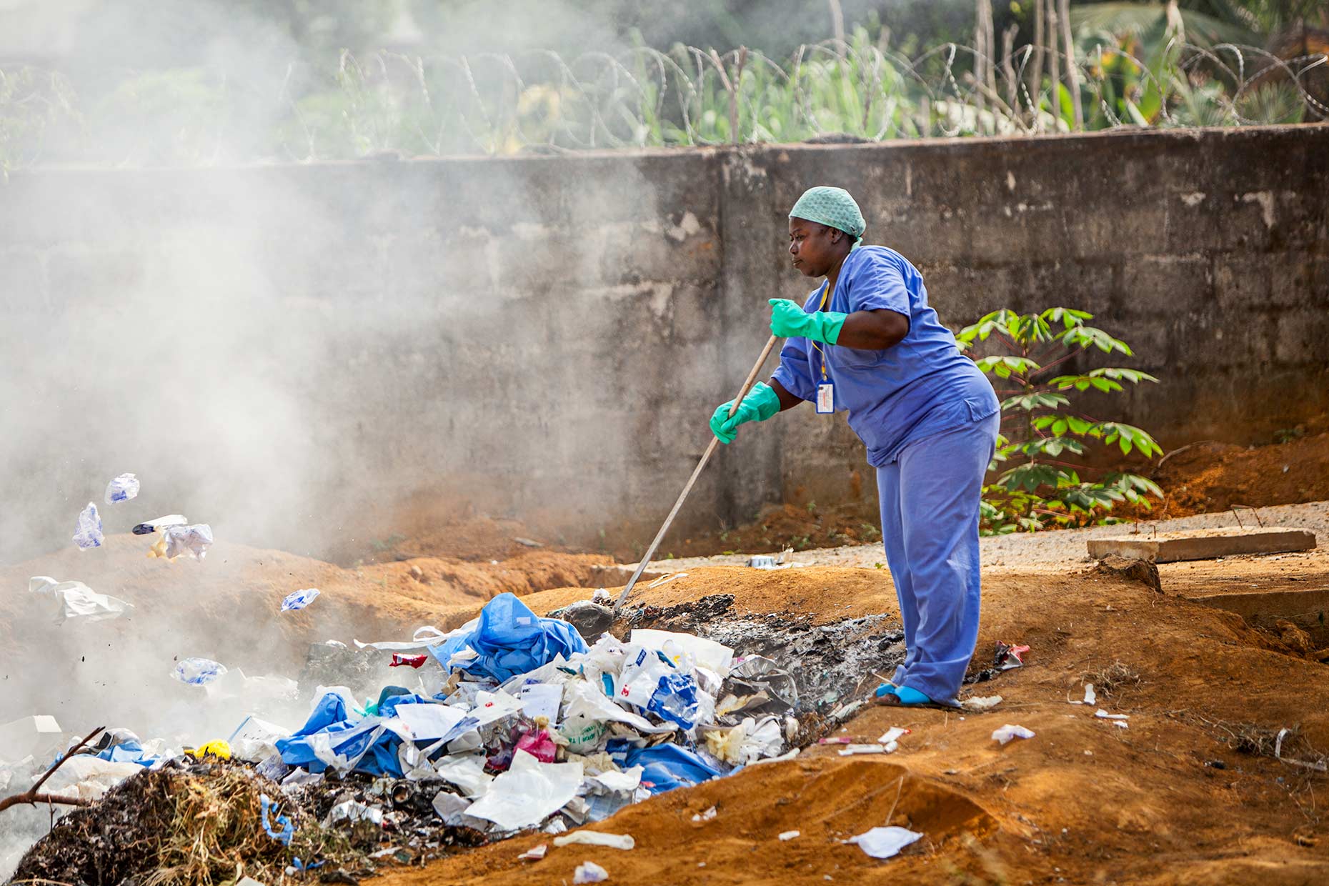 Contaminated PPE is burned next to an Ebola Treatment Unit