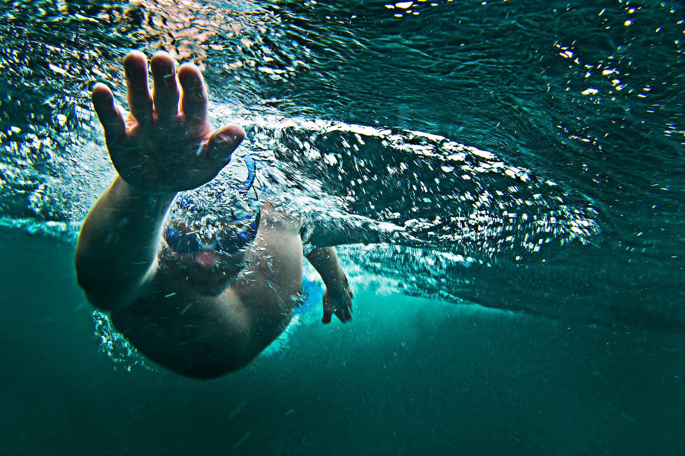 underwater action shot of long distance open water swimmer in Scotland