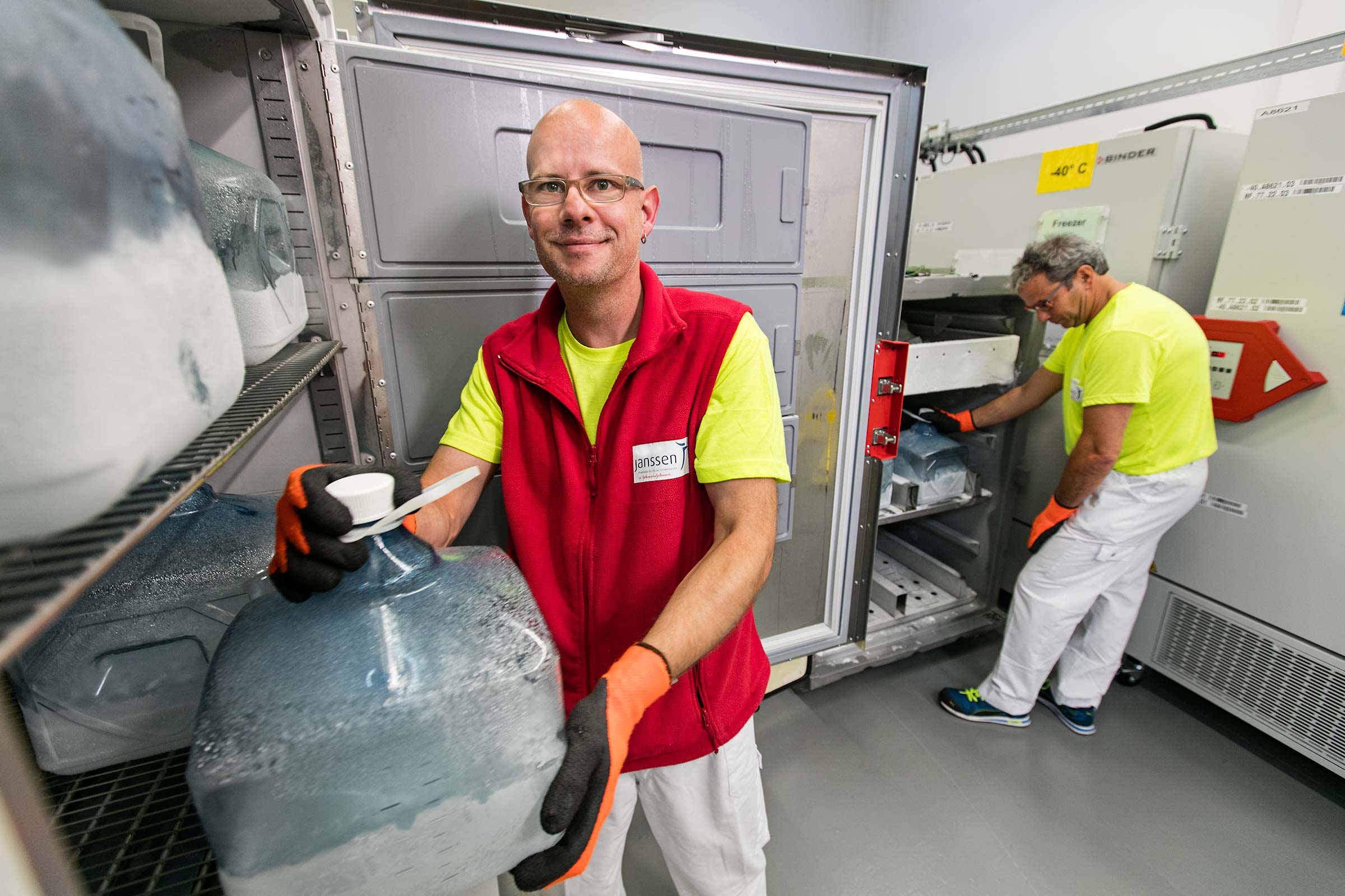 Pharmaceutical manufacturing employees working in freezer in Switzerland