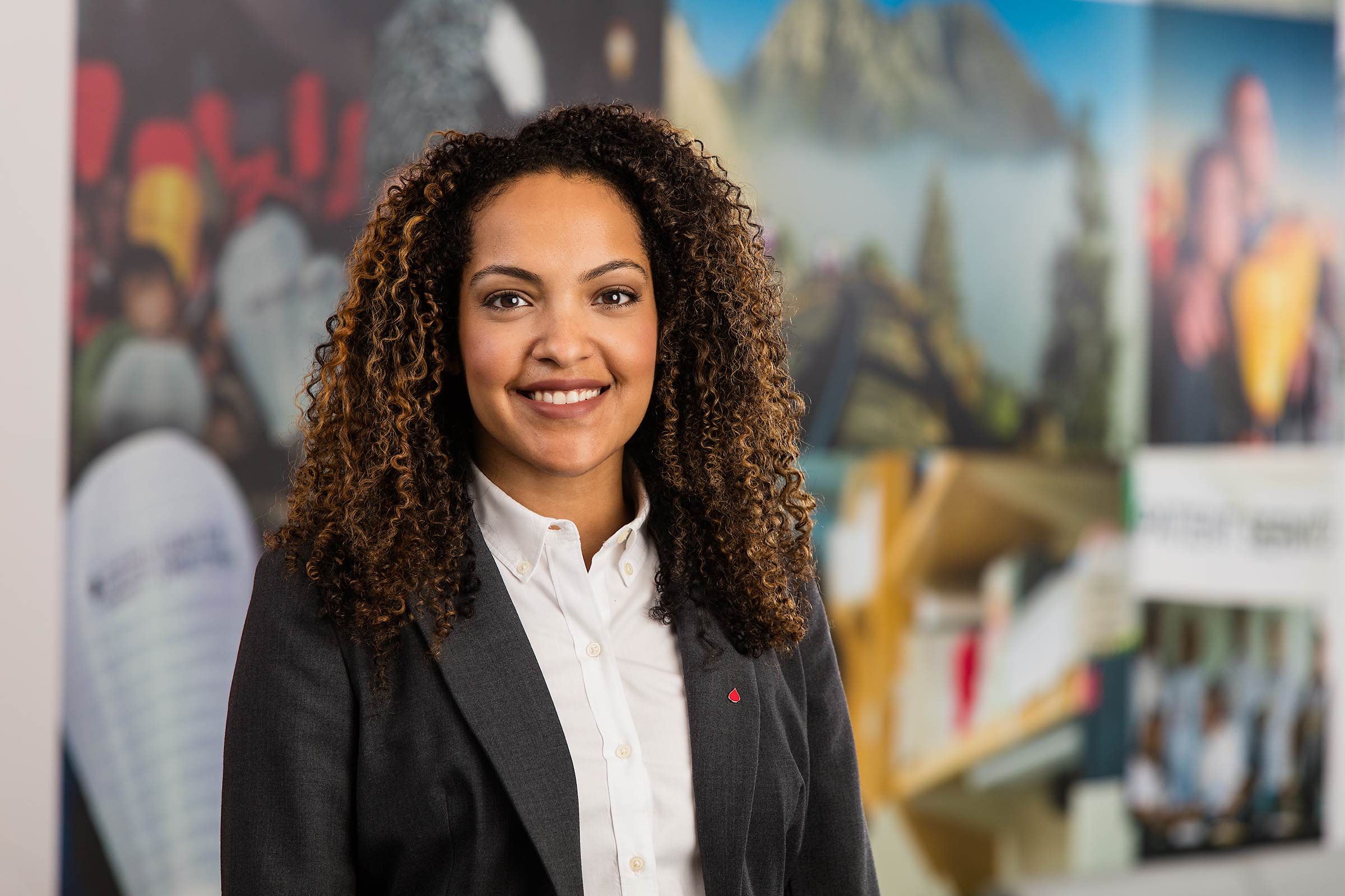 A colorful portrait of an African American woman executive in an office environment in NY