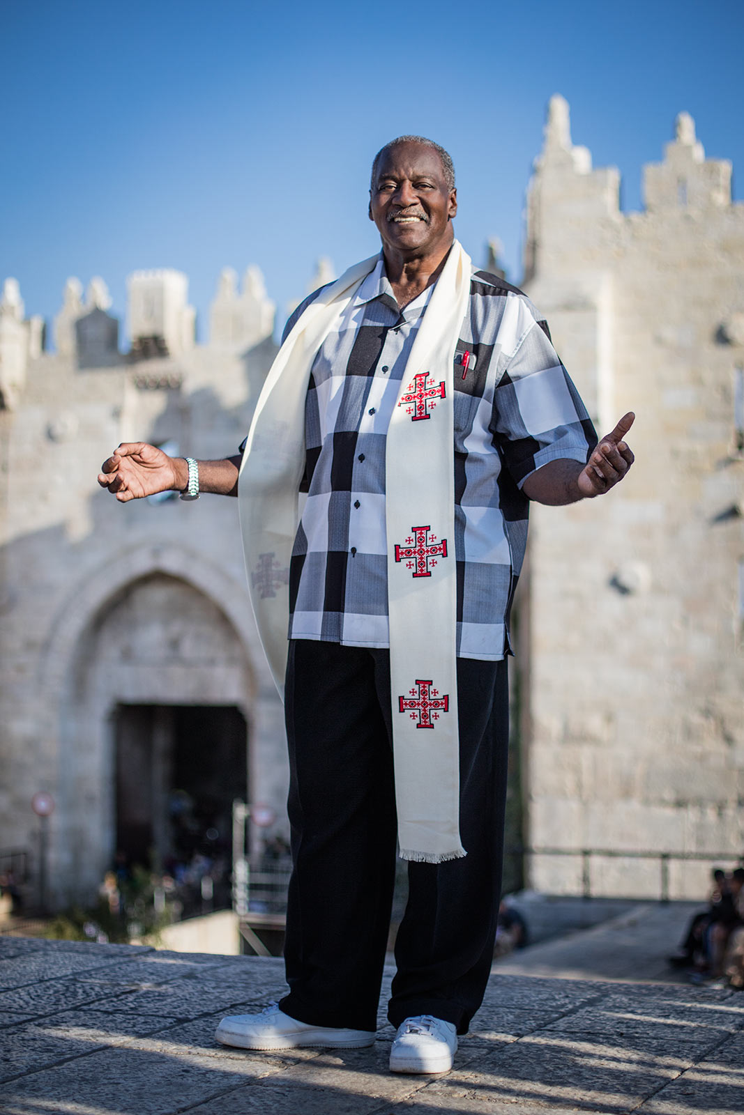 An African American reverend with his hands up in praise in Jerusalem 