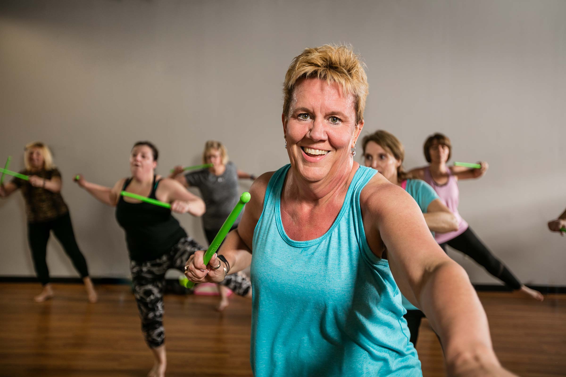 action shot of smiling older woman enagaged in healthy workout