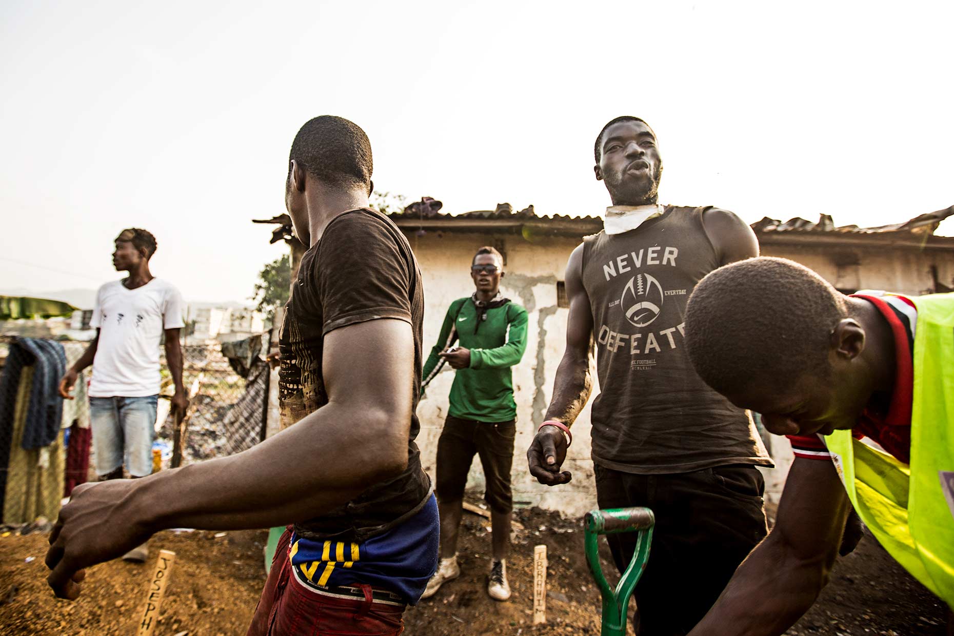 A group of workers in a heavily contaminated Ebola Graveyard