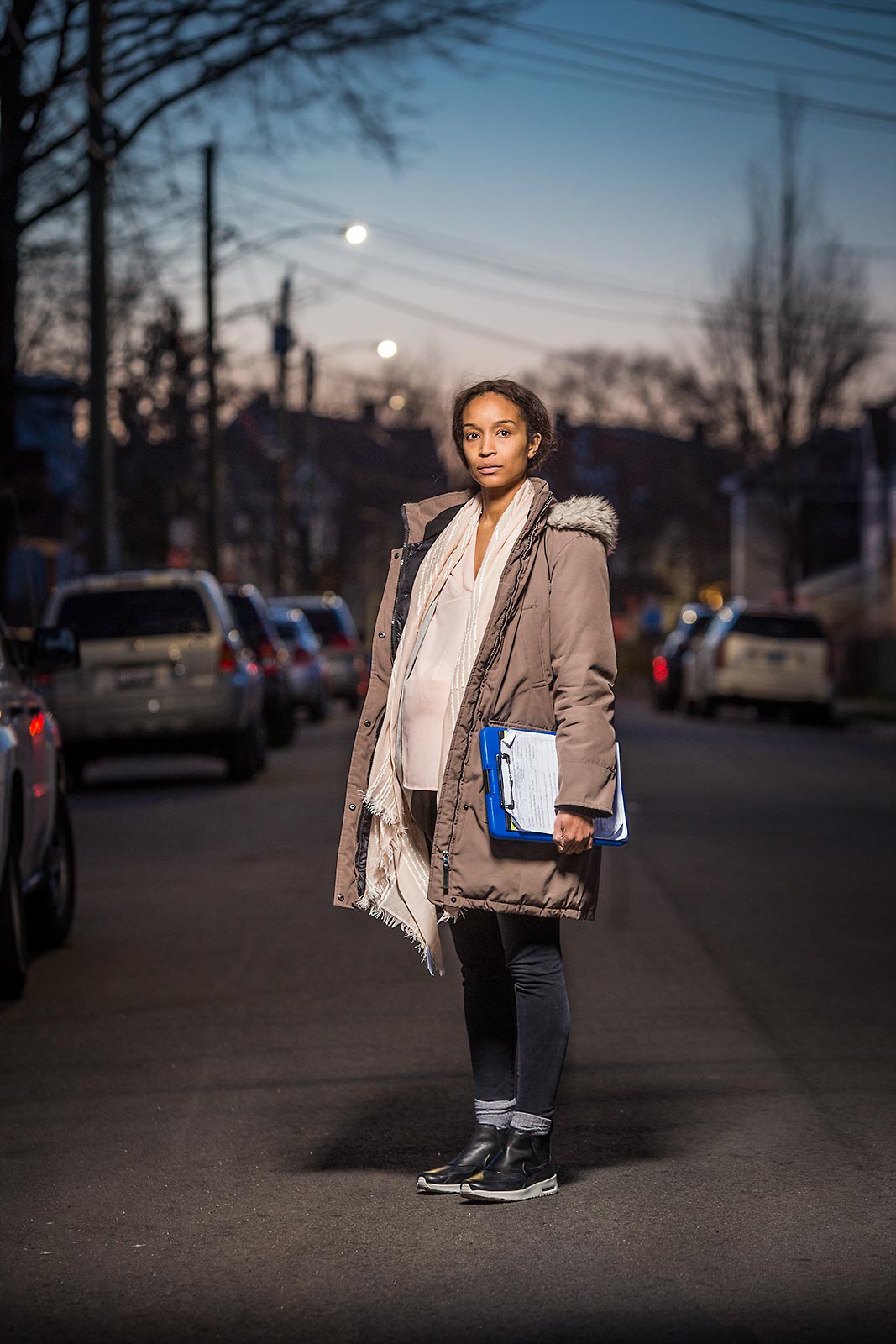 Night portrait of a pregnant African American social worker in Connecticut